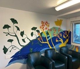 A painted mural behind chairs on Chebsey Ward
