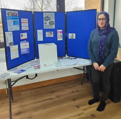 A woman stood with a presentation board.