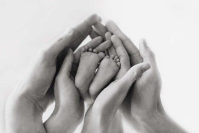 Hands holding a baby's feet