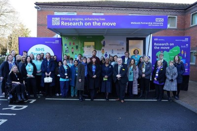 Images of a range of staff stood in front of the Research Bus