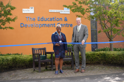A ribbon being cut by Jacqueline Small and Mike Farrar at the Education and Development Centre, St George's Hospital