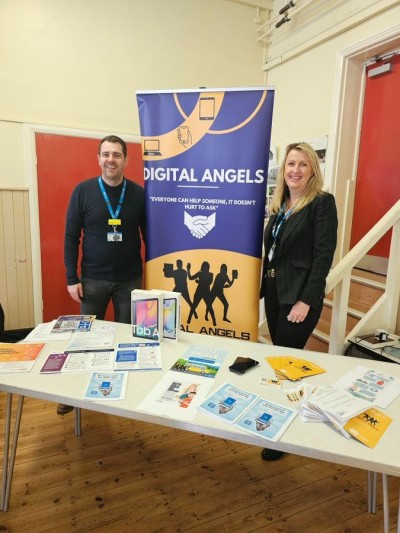 Two members of the Digital Angels team stood at their stall.